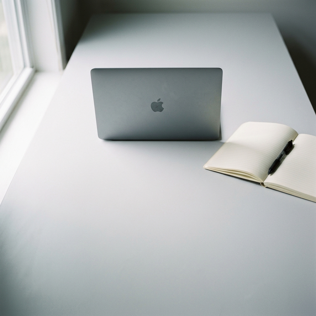 Minimalist workspace with MacBook Air overhead view